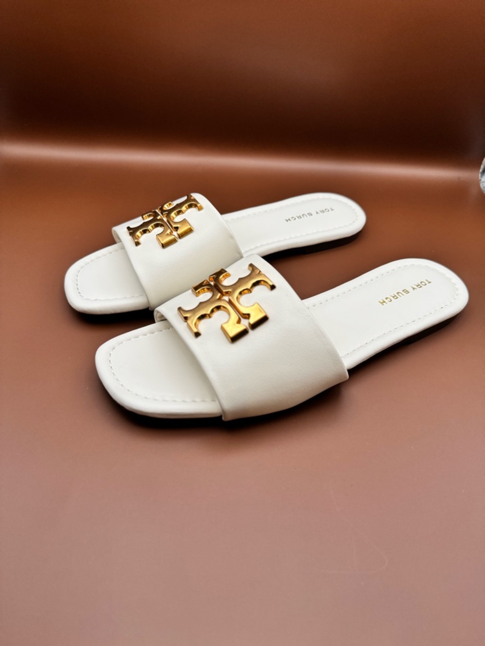 Tory Burch White Slide Sandals with Gold Logo Emblem